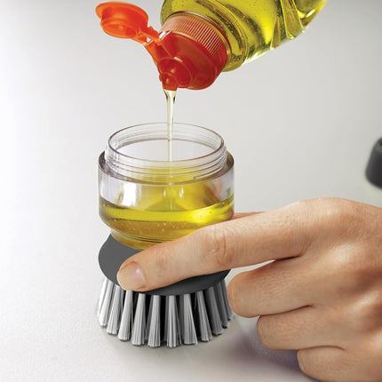 Brosse à vaisselle avec distributeur de Liquide