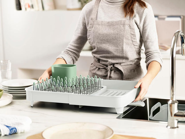 Egouttoir à vaisselle extensible avec porte-couverts amovible bec d'égouttage pivotant
