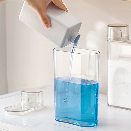 Bouteille distributrice de lessive transparente avec réservoir fermé
